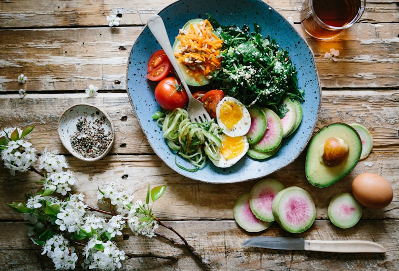 Fresh vegetables and herbal capsules representing natural wellness